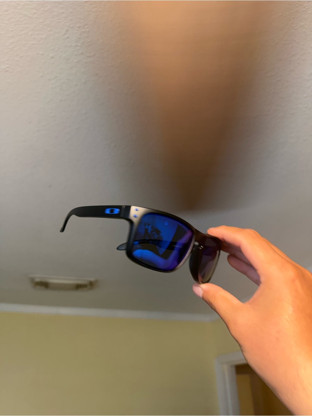 Oakley Black Frame Sunglasses with Blue Mirrored Lenses Oakley